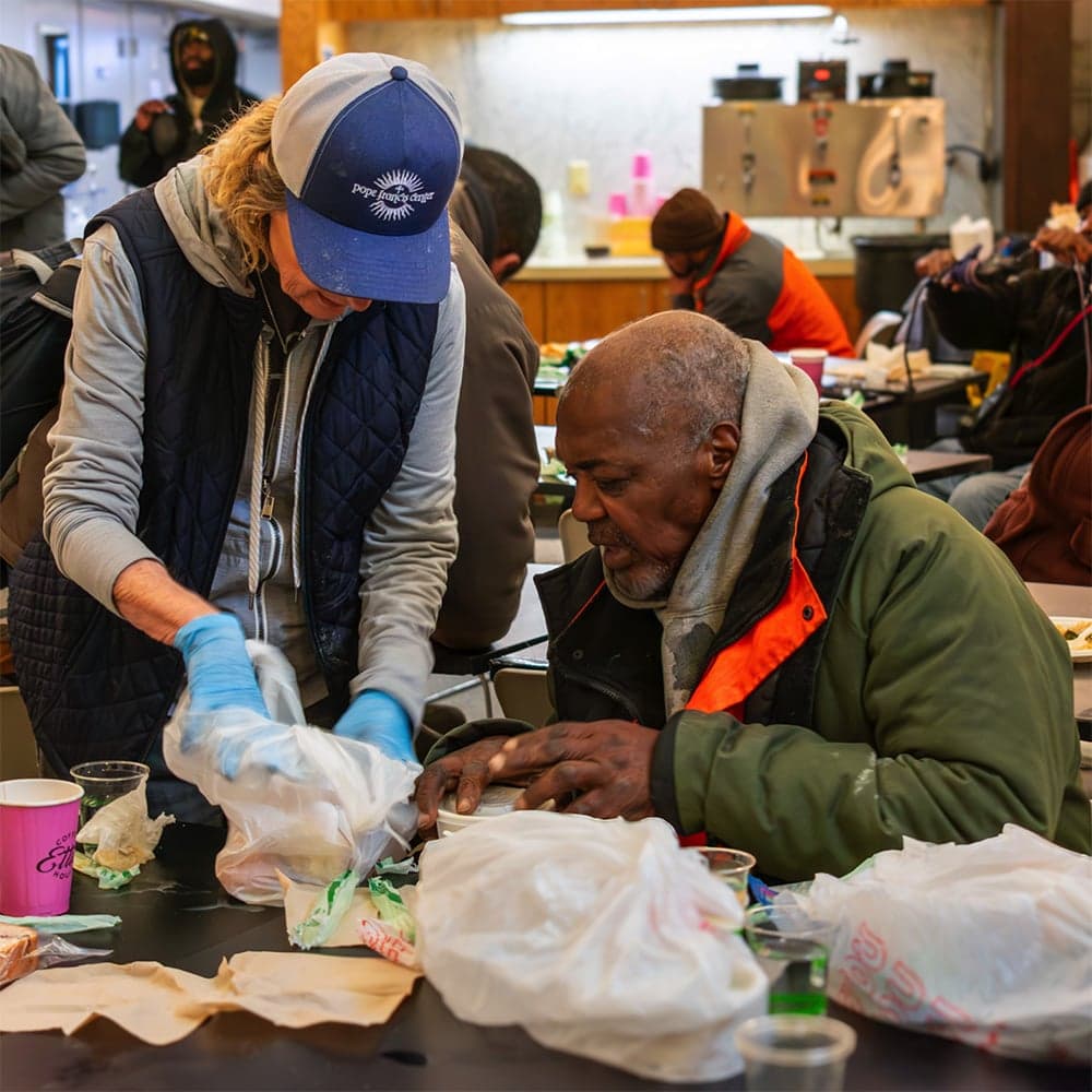PFC volunteer helping guest