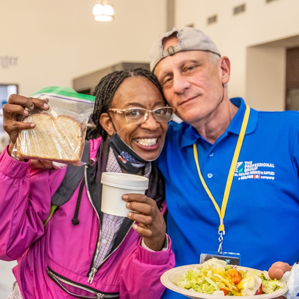 Day Center guests with food