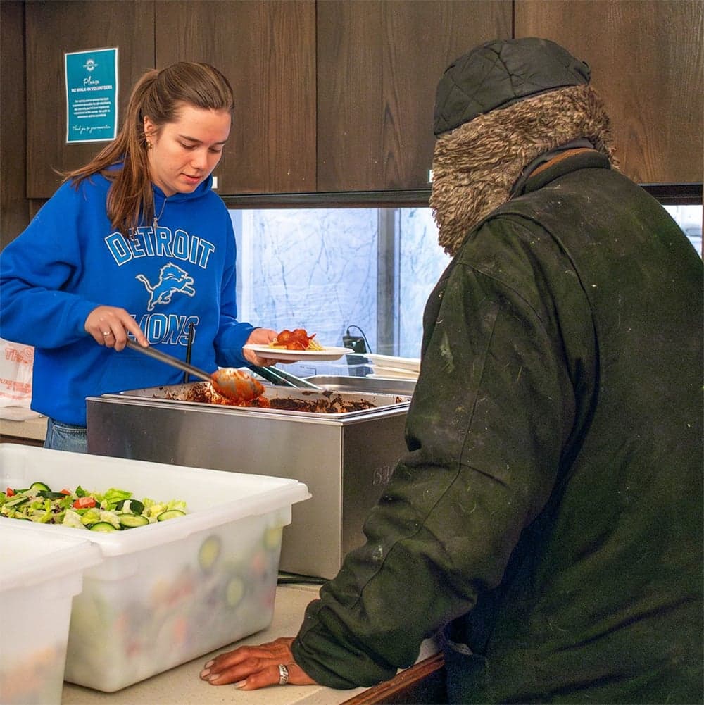 PFC volunteers serving food